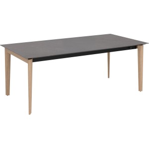 Nowoczesny stół ogrodowy z szarym blatem i jasnymi drewnianymi nogami.