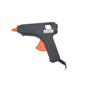 Szary pistolet do kleju z pomarańczowym spustem i dyszą.