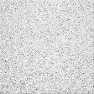 Szara płytka dekoracyjna t.b.t. z nakrapianą powierzchnią.