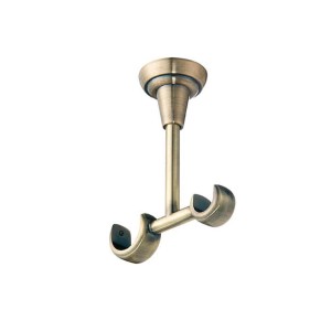 Uchwyt sufitowy do karnisza w kolorze mosiądzu.