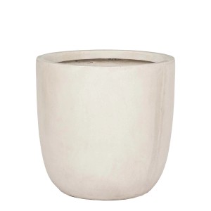 Doniczka t.b.t. w kolorze białym, okrągły kształt.