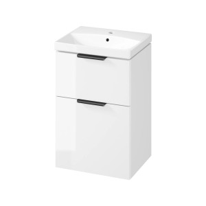 Biała szafka pod umywalkę z dwiema szufladami i czarnymi uchwytami.