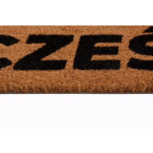 Zbliżenie wycieraczki z czarnym napisem. Kategoria: Wycieraczki.