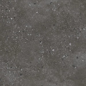 Zbliżenie szarego parapetu z nakrapianą powierzchnią.