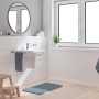 Bateria umywalkowa Grohe QuickFix Start w nowoczesnej łazience z umywalką i ręcznikiem.
