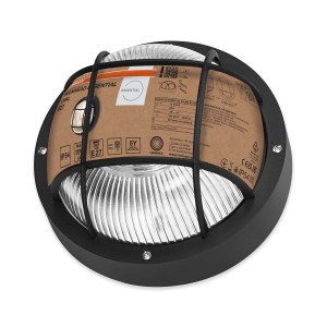 Czarna lampa warsztatowa t.b.t. z kratką ochronną i żebrowanym szkłem.