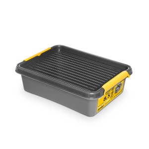 Szare pudełko do przechowywania z czarną wkładką kratową i żółtymi akcentami.