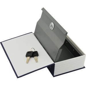 Otwarty sejf w kształcie książki z kluczami. Dyskretny sejf do przechowywania wartościowych przedmiotów.
