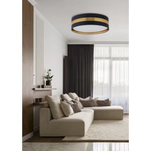 Nowoczesna lampa sufitowa t.b.t. Plafony w kolorze czarno-złotym w salonie.