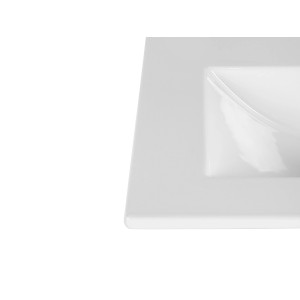 Zbliżenie białej, kwadratowej umywalki nablatowej.