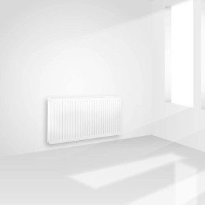 Biały grzejnik t.b.t. zamontowany na ścianie w jasnym pokoju.