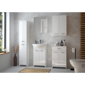 Biały zestaw mebli łazienkowych t.b.t. z szafką lustrzaną, szafką pod umywalkę i szafką wysoką.