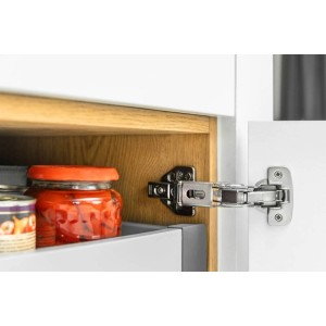 Zbliżenie zawiasu meblowego na szafce.