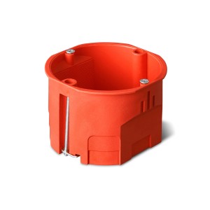 Pomarańczowa puszka podtynkowa do instalacji elektrycznych.