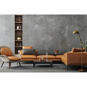 Nowoczesny salon z brązową skórzaną sofą, fotelem, stolikiem kawowym i lampą podłogową na tle szarej ściany.