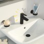 Czarna bateria umywalkowa Grohe QuickFix Start S-Size na białej umywalce z mydłem i szczoteczką do zębów.