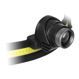 Zbliżenie czarnej latarki czołowej t.b.t. z żółtą opaską.