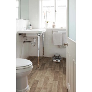 Łazienka z wykładziną PCV t.b.t. imitującą drewno.