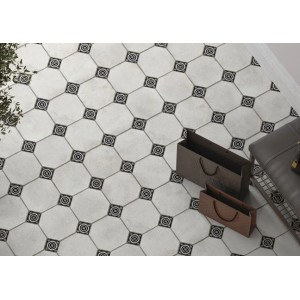 Ułożony wzór płytek podłogowych t.b.t. w kolorze szaro-białym z elementami dekoracyjnymi.