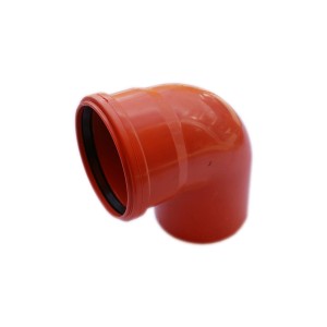 Pomarańczowe kolano t.b.t. do rur gruntowych.