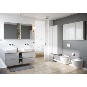 Nowoczesna łazienka z białym zestawem mebli łazienkowych t.b.t., umywalką, WC i bidetem.