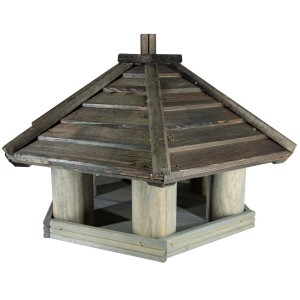 Drewniany karmnik dla ptaków z dachem, miejsce karmienia dla ptaków ogrodowych.