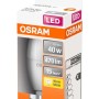 Żarówka LED Osram E14 w kształcie świeczki, 4,9W, ciepła biel, w opakowaniu.