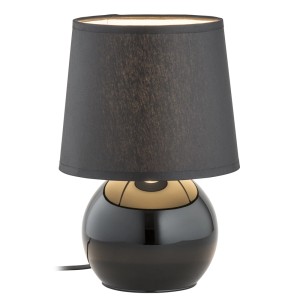 Czarna lampa stołowa z okrągłą podstawą i materiałowym abażurem dla nastrojowego oświetlenia.