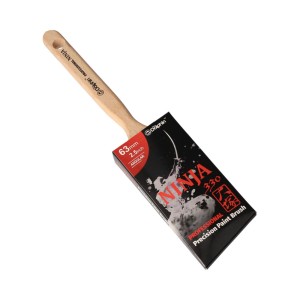 Pędzel t.b.t. z drewnianą rączką i opakowaniem.