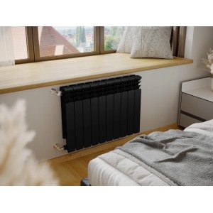 Czarny grzejnik t.b.t. pod oknem w nowoczesnej sypialni.