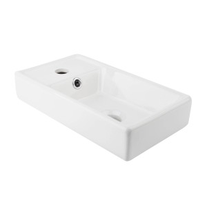 Prostokątna, biała umywalka nablatowa t.b.t. z otworem na baterię.