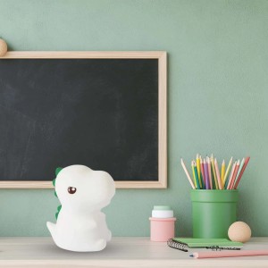 Biała lampka nocna w kształcie dinozaura do pokoju dziecięcego, dekoracja stołu.