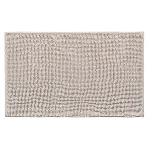 Beżowy dywanik łazienkowy o strukturze pętelkowej, pasujący do każdej łazienki.