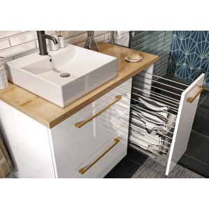 Szafka umywalkowa z białą umywalką nablatową i szufladami z koszem na pranie.