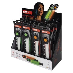 Ekspozycja opasek LED EMOS, zielonych i pomarańczowych, dla lepszej widoczności w ciemności.