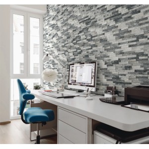 Aranżacja ściany z szarymi kamieniami dekoracyjnymi t.b.t. w gabinecie.