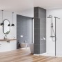 Nowoczesna łazienka z baterią umywalkową t.b.t., prysznicem i WC w stylowym designie.