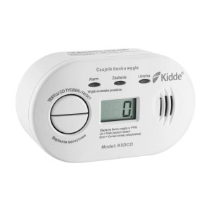 Biały czujnik tlenku węgla Kidde t.b.t. z wyświetlaczem LCD i przyciskiem testowym.