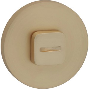 Złota rozeta klamki drzwiowej, zbliżenie. Okucia do drzwi wewnętrznych.