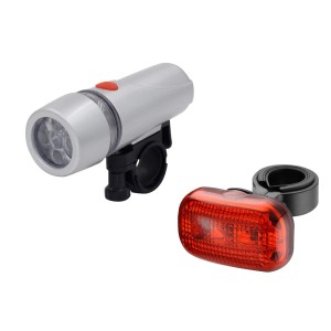 Zestaw oświetlenia rowerowego: Srebrna lampka przednia i czerwona lampka tylna.