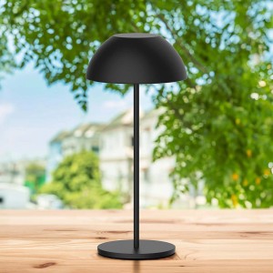 Czarna lampa stołowa t.b.t. w nowoczesnym stylu do użytku wewnątrz i na zewnątrz.