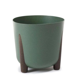 Zielona doniczka z brązowymi nóżkami. Dekoracyjne doniczki do wnętrz i na zewnątrz.