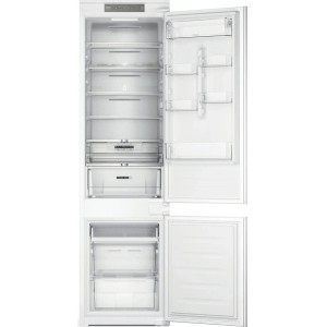 Otwarta, biała lodówka do zabudowy t.b.t. z szufladami i półkami.