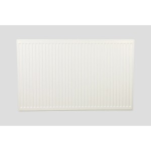 Biały grzejnik t.b.t. do montażu na ścianie.