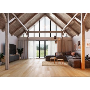 Jasny salon z panelami winylowymi t.b.t. imitującymi drewno. Przytulna atmosfera z sofą i dużą ilością światła dziennego.