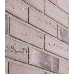 Zbliżenie ściany z cegieł t.b.t., dekoracyjne Kamienie i klinkier w odcieniach beżu i brązu.