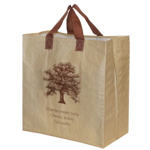 Beżowa torba na zakupy z motywem drzewa i brązowymi uchwytami. Ekologiczna pomoc w zakupach.