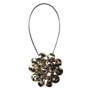 Złoty podwiązek do zasłon w kształcie kwiatu.