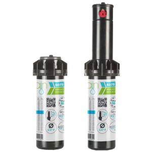Dwa czarne zraszacze Rain Bird S075 do nawadniania ogrodu.