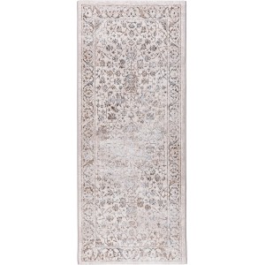 Beżowy dywan z krótkim włosiem we wzory kwiatowe.